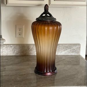 Large rust colored decorative glass jar